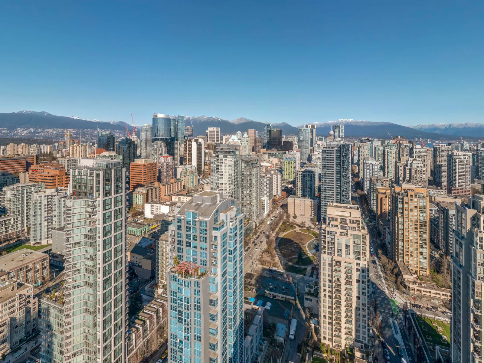 The view north from level 40 over downtown Vancouver toward the North Shore mountains, captured by drone for Larco Properties